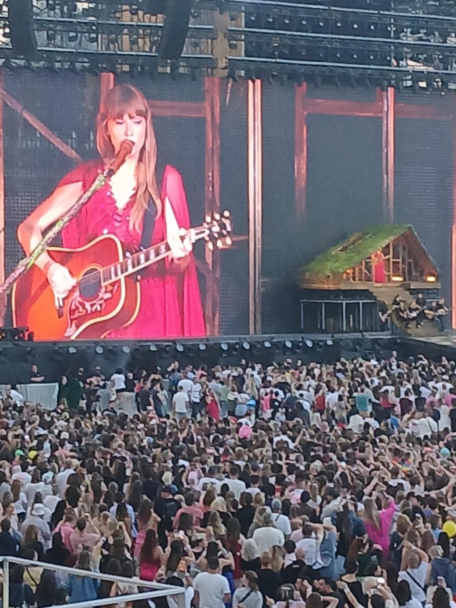 Swift plays the guitar and sings "betty"